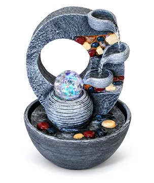 Water feature layered pots and coloured stones