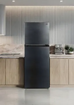 A modern Midea Fridge Freezer with a brushed dark stainless steel finish, centered in a minimalist kitchen with light wood cabinets and a marble backsplash